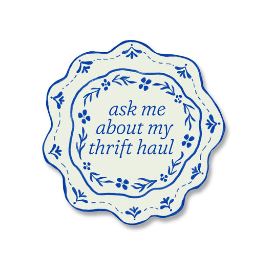 sticker of a porcelain plate decorated with blue floral designs with the words ask me about my thrift haul