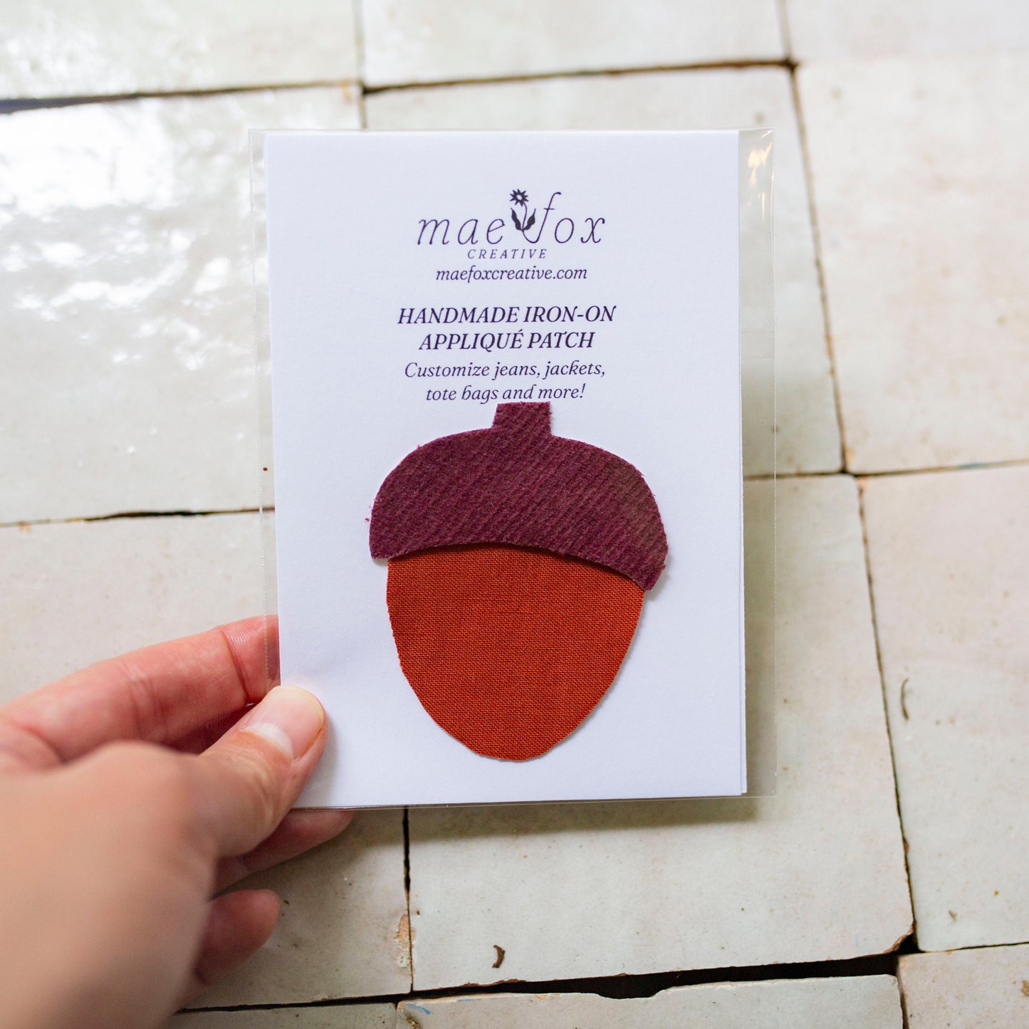 Handmade appliqué patch shaped like an acorn, crafted from mixed vintage fabrics  slightly imperfect, charming handmade finish, designed for decorating jackets, jeans, or tote bags.
