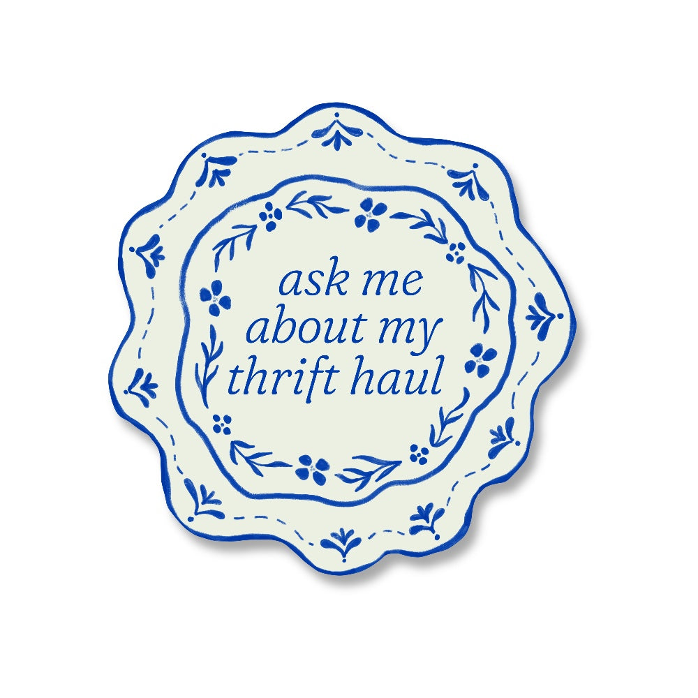 sticker of a porcelain plate decorated with  blue floral designs with the words ask me about my thrift haul