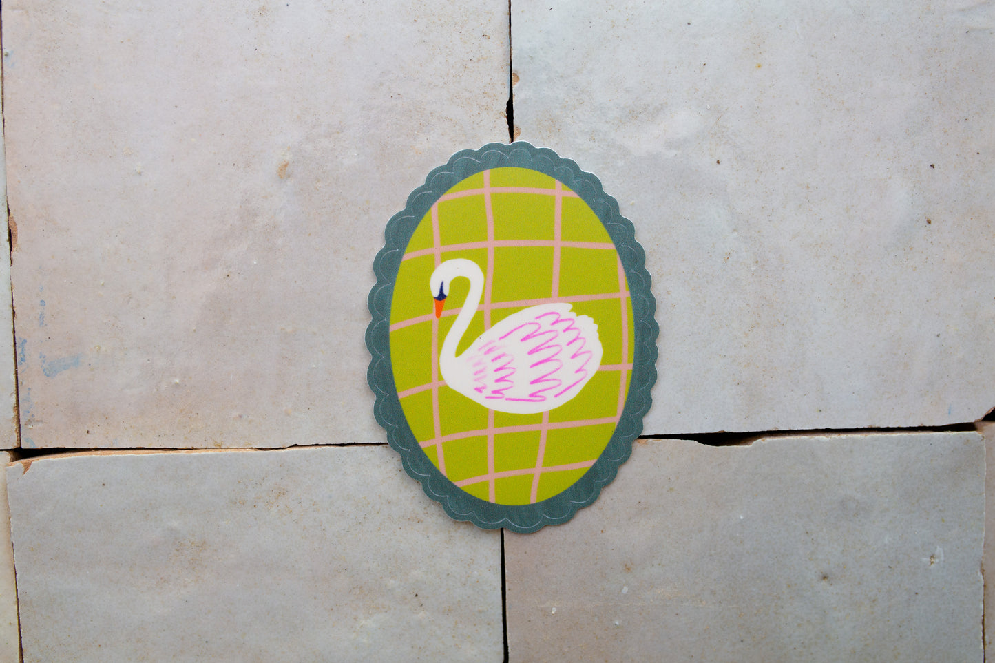 scalloped oval Swan Sticker that is green