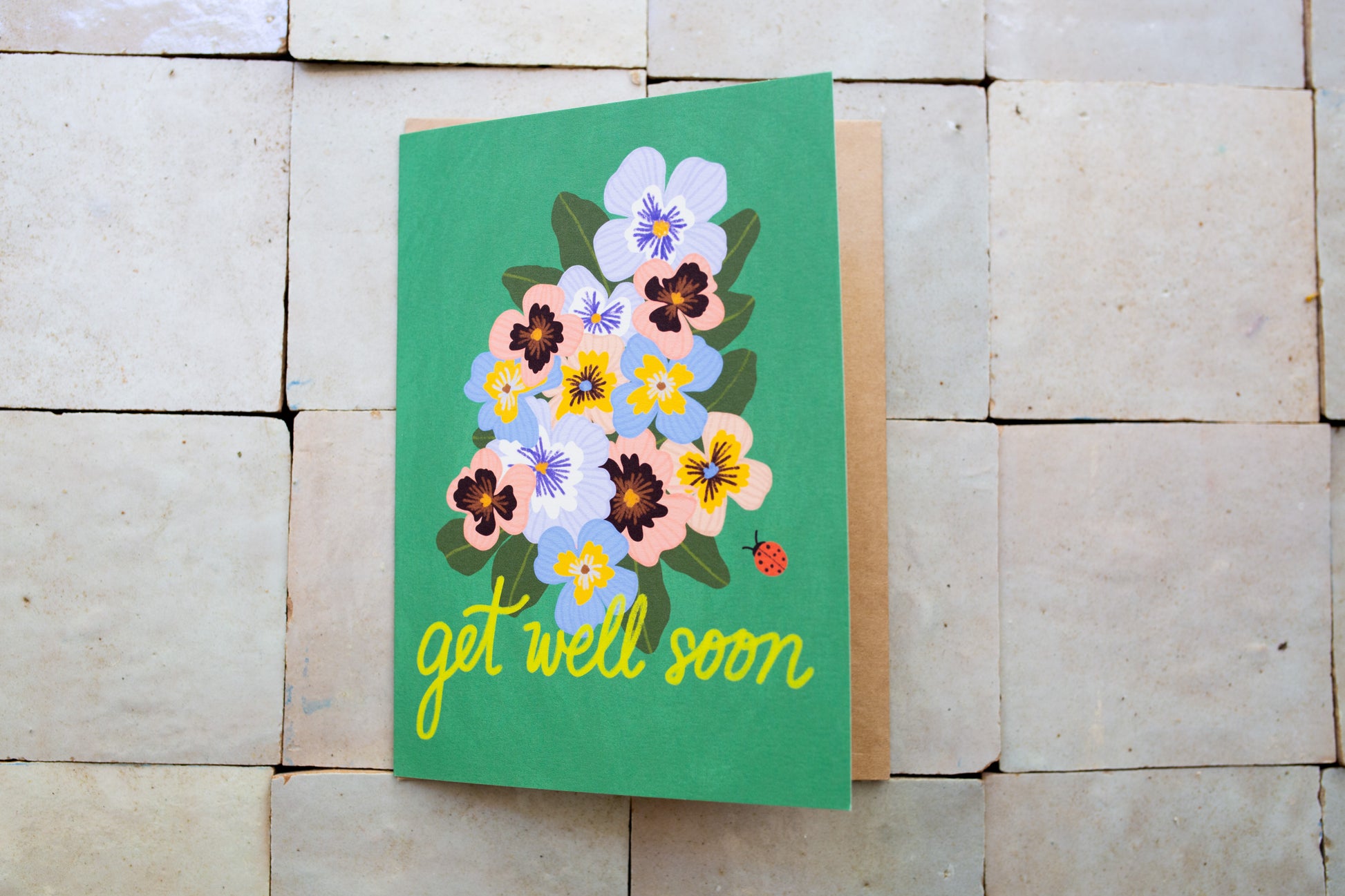 Card with pansies and 'get well soon' text 