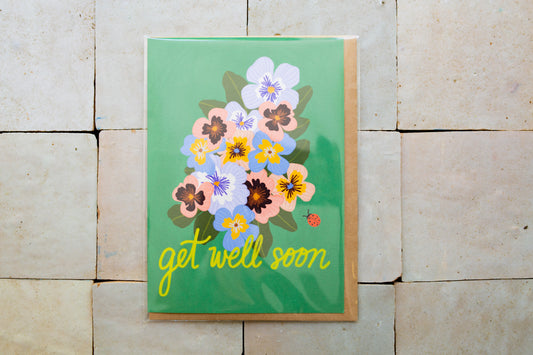 Greeting card with floral design and 'get well soon' text 