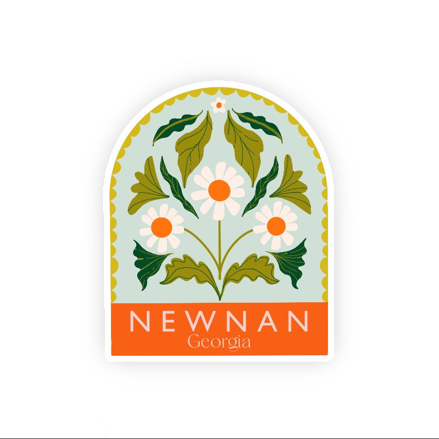 Decorative sticker with floral design and 'Newnan Georgia' text on a light blue background