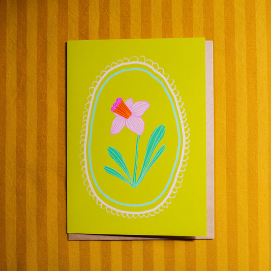 Card with a floral design on a yellow background