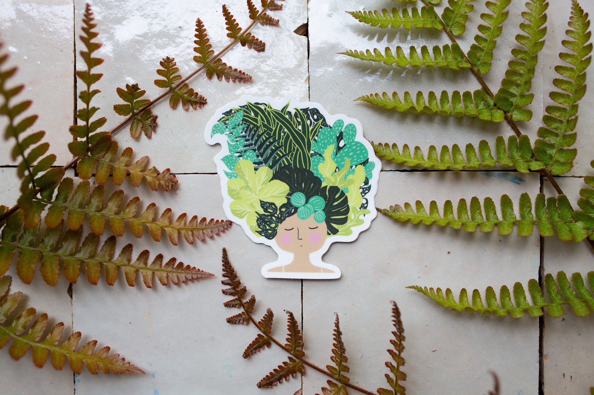 whimsical sticker of a woman lying down with hair made of lush houseplants, perfect gift for plant lovers.