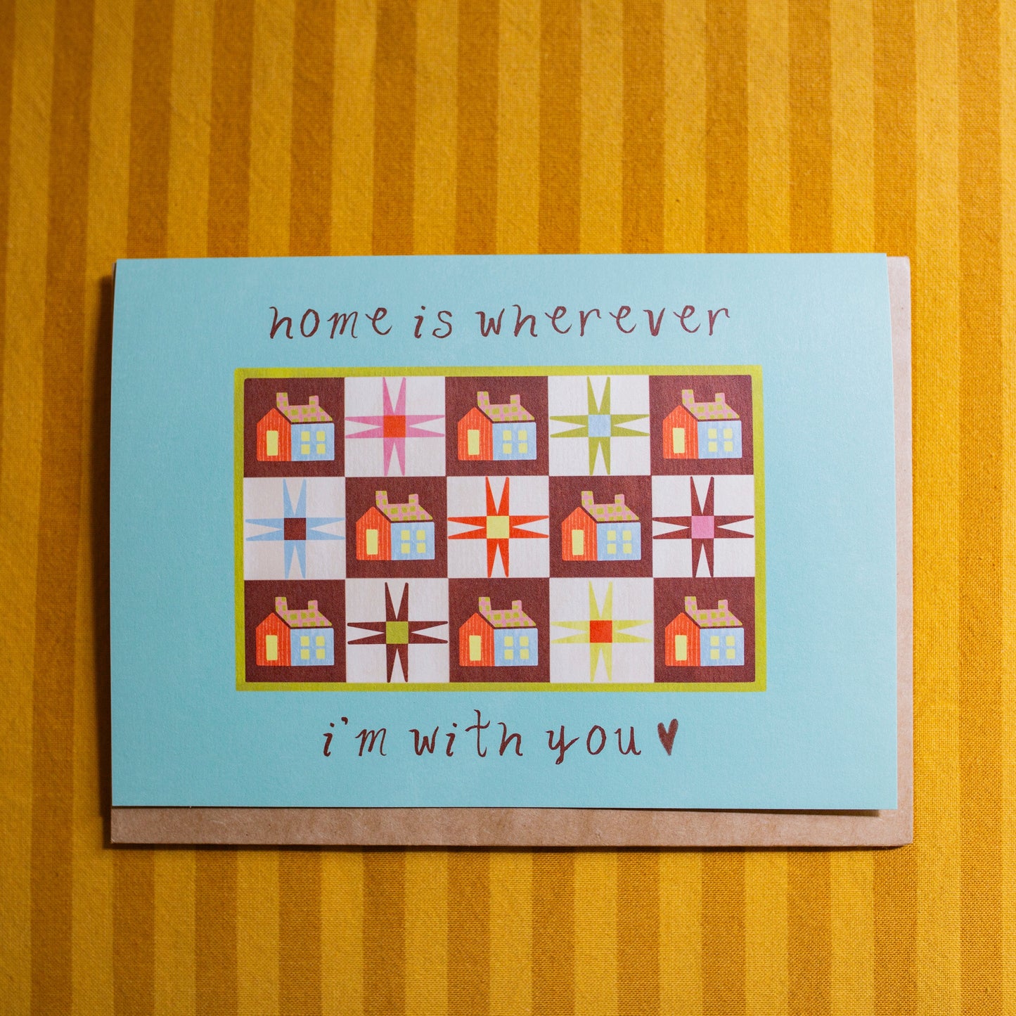 Greeting card with quilt design and text that says "Home Is Wherever I'm with You" 
