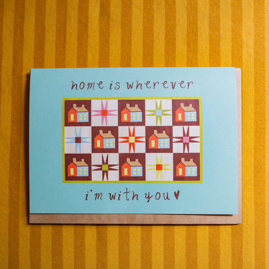 Greeting card with quilt design and text that says "Home Is Wherever I'm with You" 