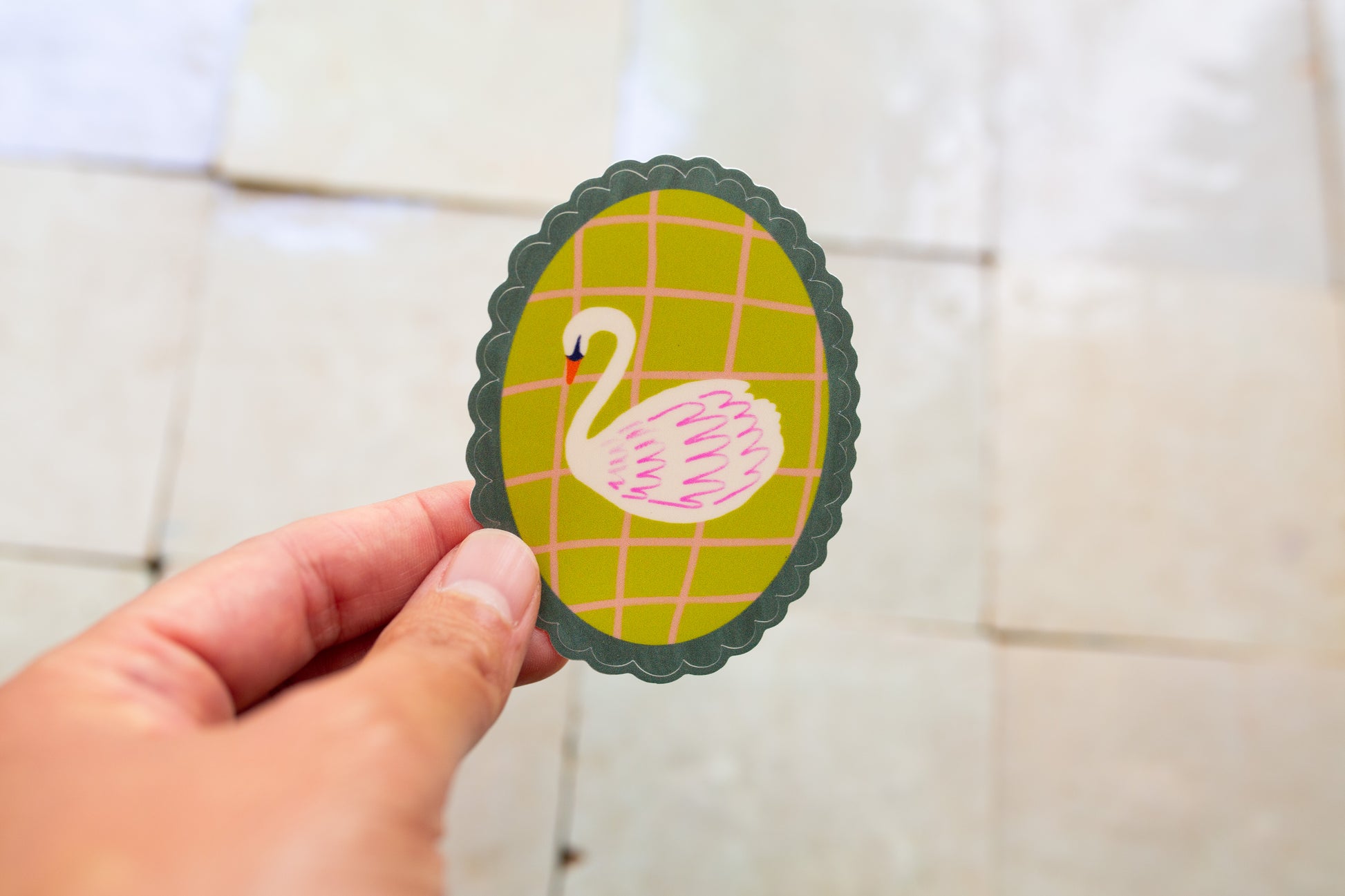scalloped oval Swan Sticker that is green