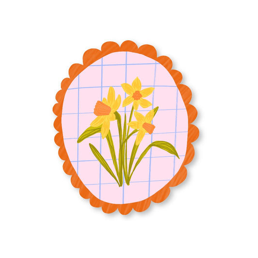 Daffodil vinyl sticker featuring a hand drawn yellow flower with orange scalloped border, perfect gift for plant and flower lovers.