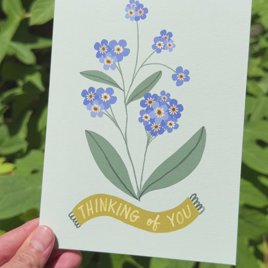 Video of Thinking of You Card With Forget Me Nots on Blue Background